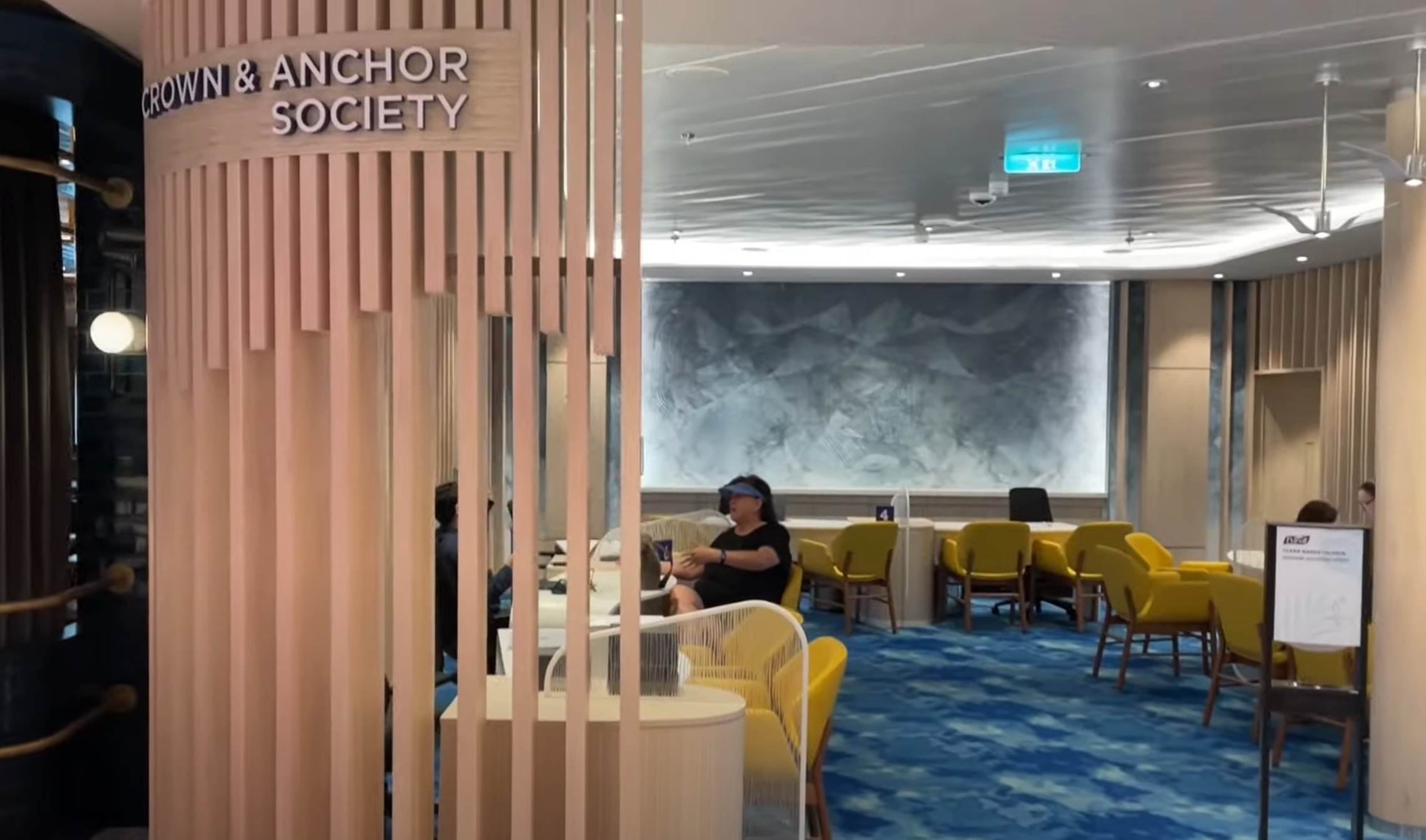 A group of people sitting in a room

Description automatically generated