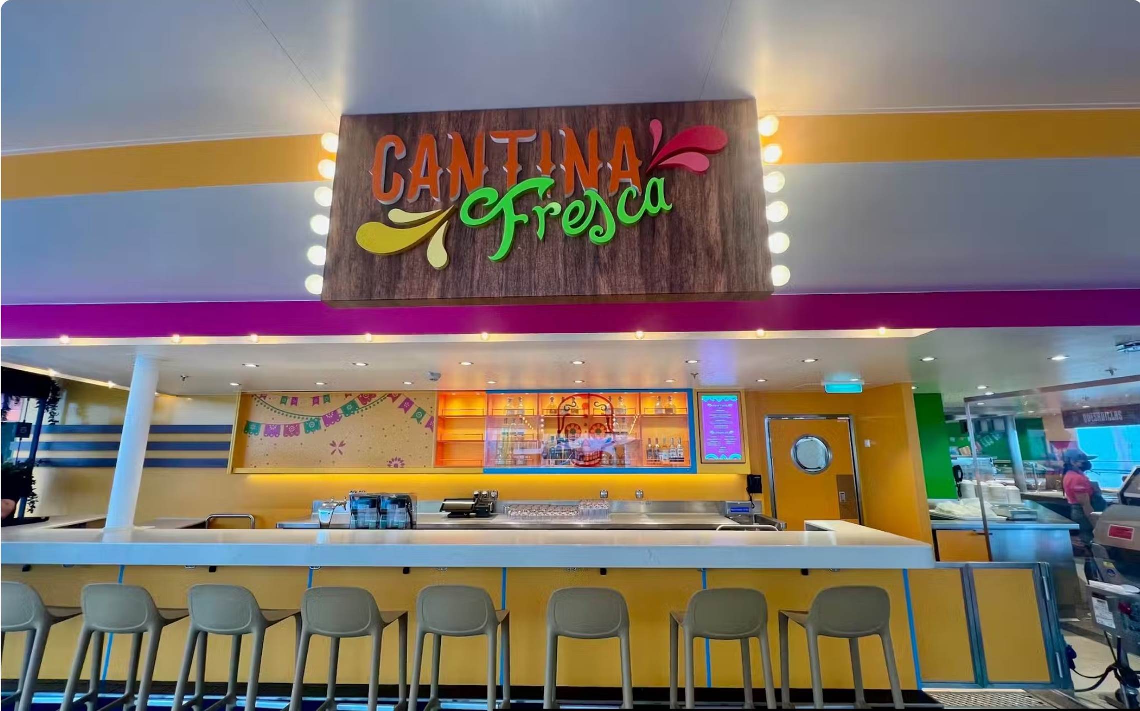A restaurant with a sign above it

Description automatically generated
