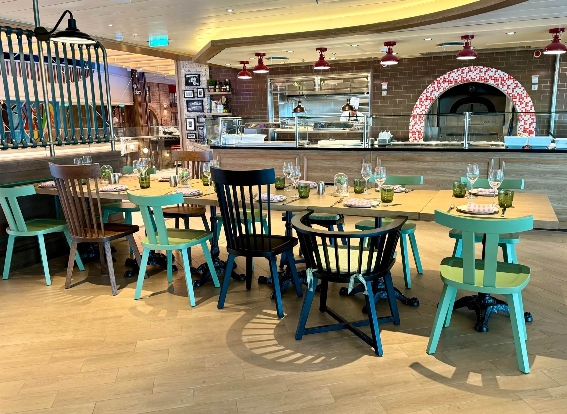 A restaurant with many chairs and tables

Description automatically generated