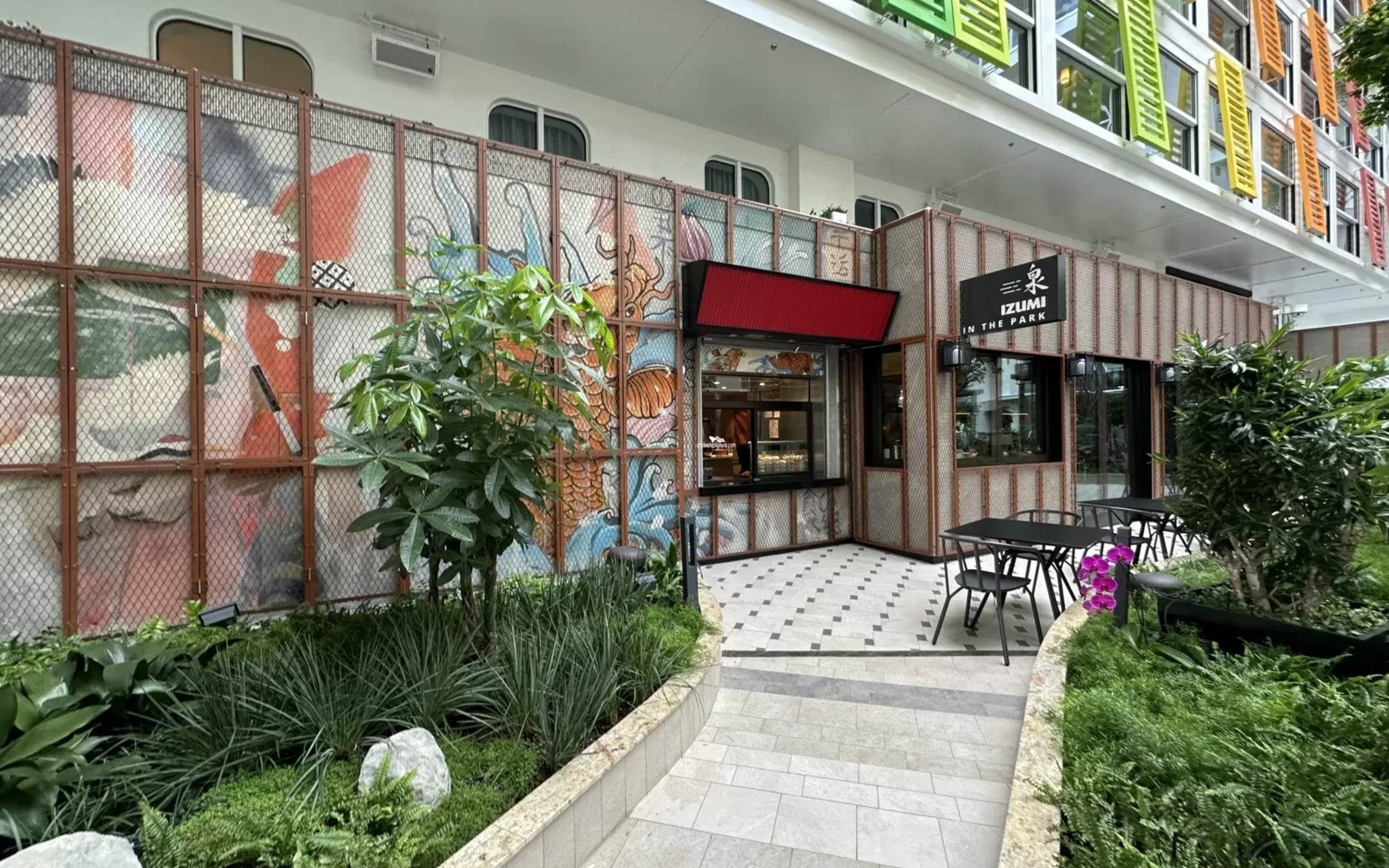 A building with a fence and a sidewalk

Description automatically generated with medium confidence