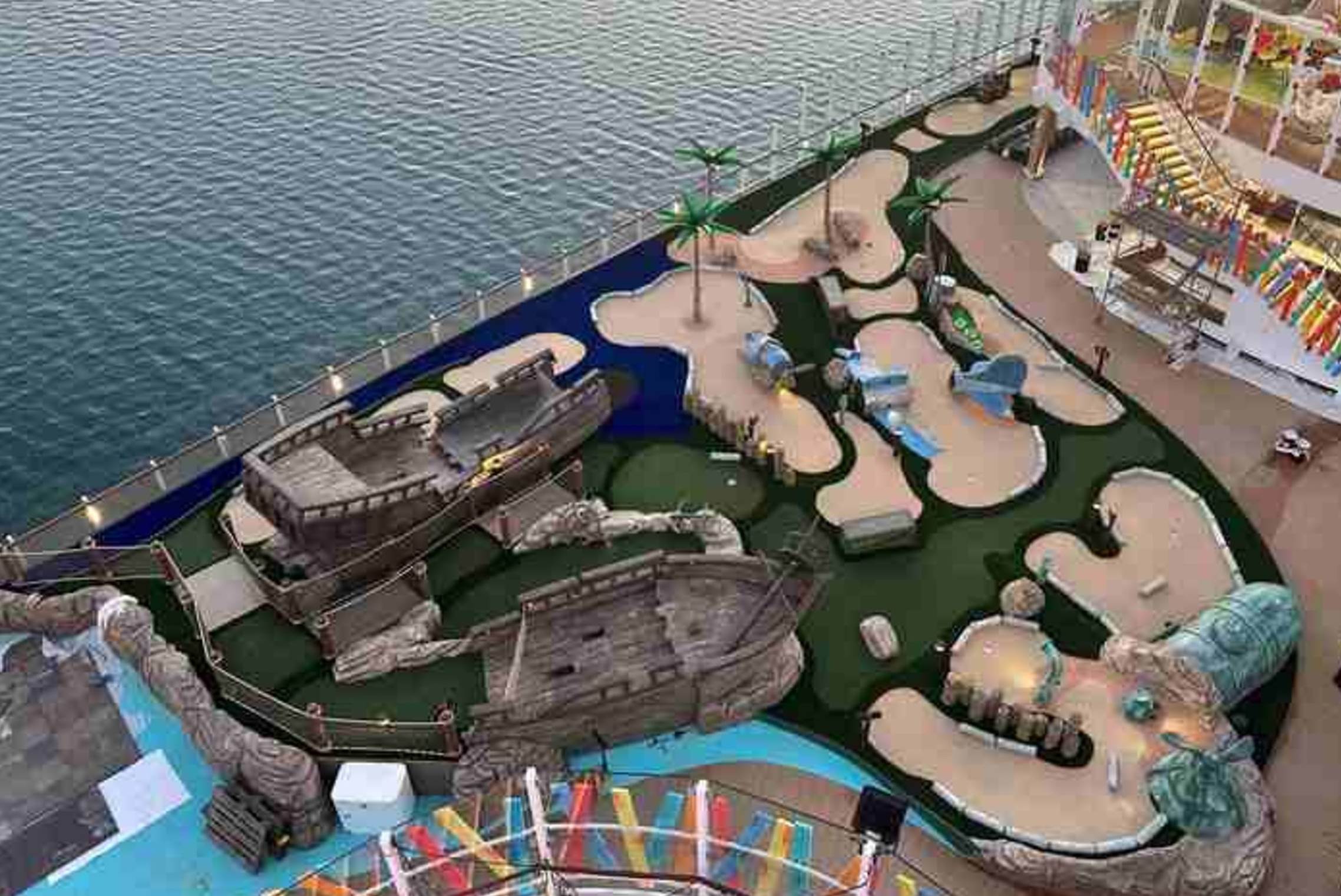 A aerial view of a mini golf course

Description automatically generated