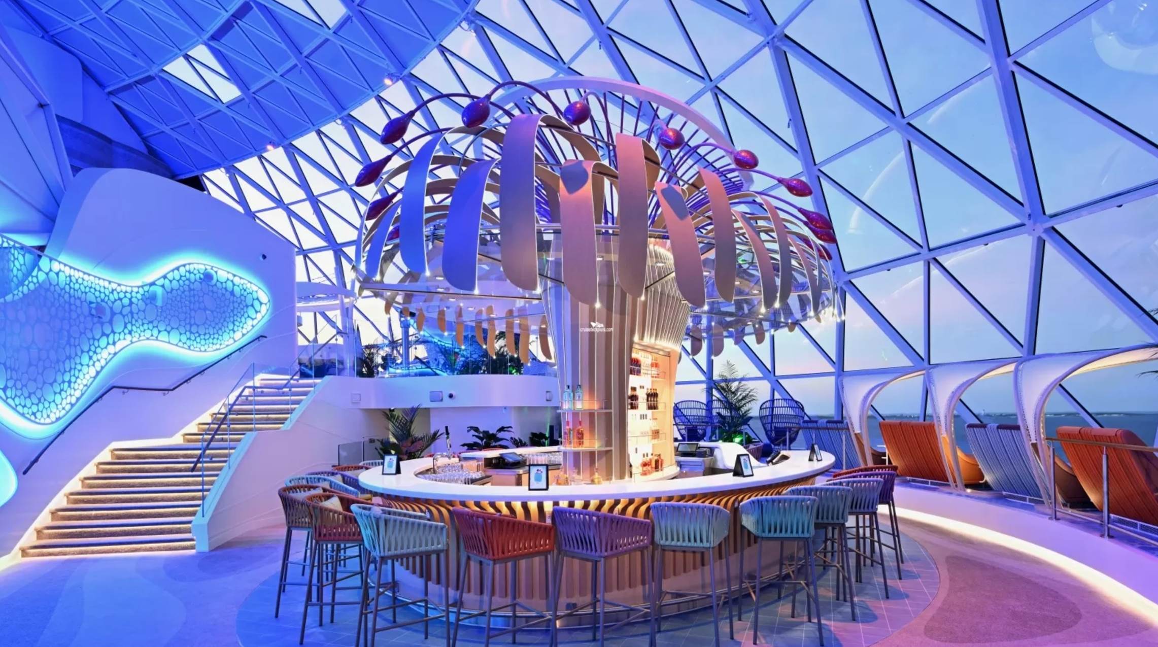 A bar with a palm tree in the middle

Description automatically generated